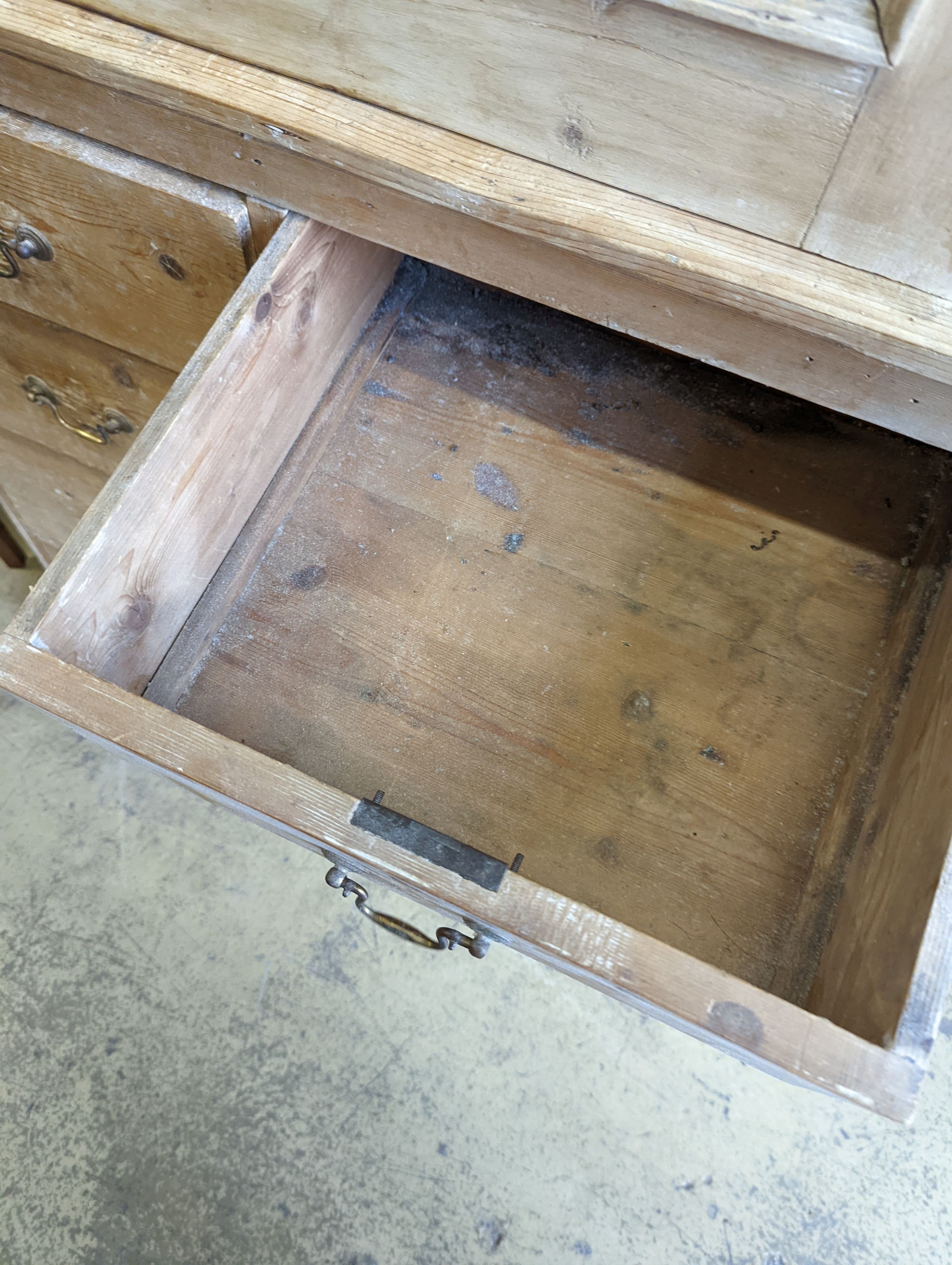An Edwardian pine kitchen cupboard with five drawer base, width 94cm, height 193cm